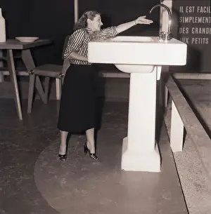 Faucet Prints: Woman Reaches For Oversized Faucet