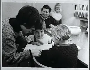 Thalidomide Prints: Woman Reading to Children