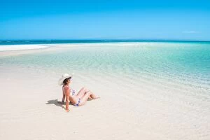 Tropics Gallery: Woman relaxing on the beach. Turquoise Bay, Western Australia