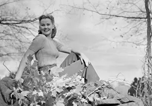 Hair Back Prints: Woman relaxing in countryside, portrait