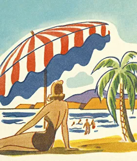 Palm Collection: Woman Relaxing Under an Umbrella on the Beach