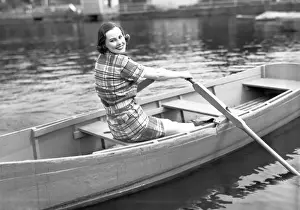 30 35 Years Prints: Woman rowing boat on lake, (B&W), portrait