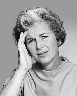 Headache Prints: Woman rubbing forehead