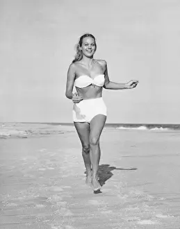 Woman running on beach
