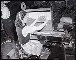 Sorting Prints: Woman Seated At Cigarette Machine