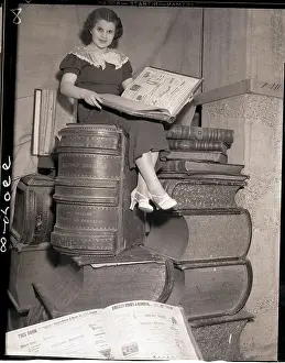 Autograph Prints: Woman Seated on Stack of Huge Books