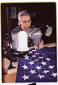 Woman Sewing Stars on a American Flag