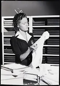 Towel Prints: Woman Shopper Examining Towel
