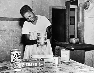 Kitchen Prints: Woman Sifting Flour In Kitchen