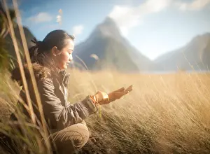 Ponytail Prints: Woman siting in grass field