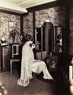 Applying Prints: Woman Sits @Vanity Applies Lipstick