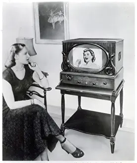 Woman Sits And Watches Television In Ad