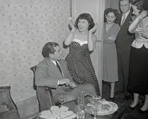 Woman Sitting on Arm of Lucky Luciano's Armchair
