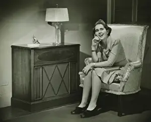 40 49 Years Prints: Woman sitting in armchair, smiling, (B&W)