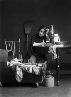 Motherhood Prints: Woman sitting next to crib