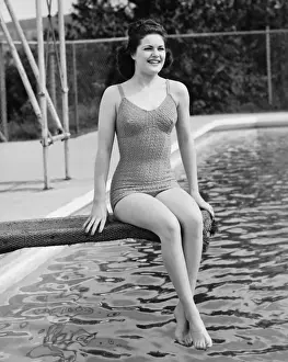 Swimwear Prints: Woman sitting on diving board (B&W), portrait