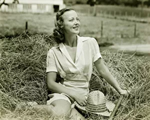 Soft Collection: Woman sitting on haystack, (B&W), portrait