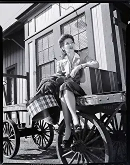 Patience Prints: Woman Sitting on Luggage Trolley