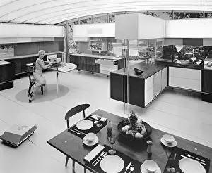 Woman Sitting in Modernized Kitchen