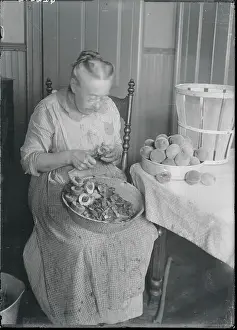 Woman Slicing Peaches