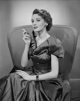 Easy Retouch Prints: Woman smoking cigarette in armchair, portrait
