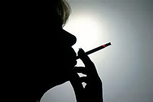 Woman smoking a cigarette, silhouette