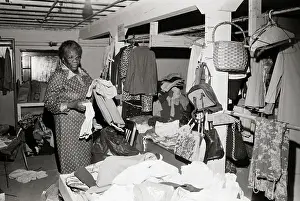 Sorting Prints: Woman Sorting Clothes for Homeless