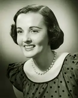 Polka Dot Prints: Woman in spotted dress posing in studio, (B&W), (Close-up), (Portrait)