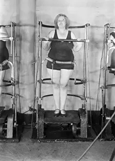 Gymnasium Prints: Woman Standing On Exercise Machine