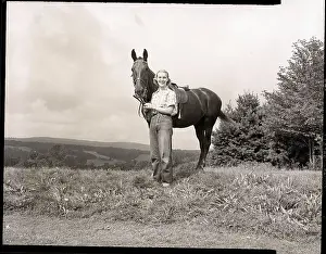 Woman Standing Beside Horse