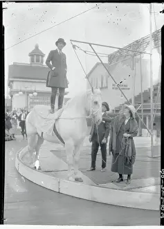 Woman Standing on Horseback