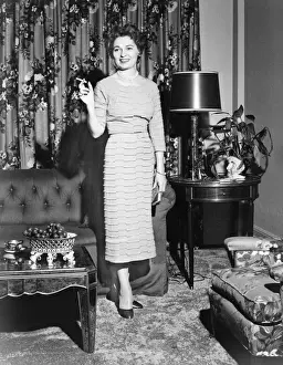 Stylish Prints: Woman standing in rich living room, holding cigarette, (B&W)
