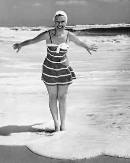 Swimwear Prints: Woman standing in shallow water at ocean