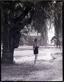 Woman Standing Under a Tree