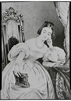 Adoration Prints: Woman Staring at Photograph