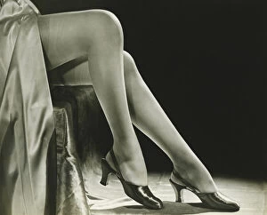 Stockings Gallery: Woman in stockings sitting on chair, close-up of legs, (B&W), low section