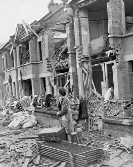 Air Raid Prints: Woman Surveys Damage to Houses