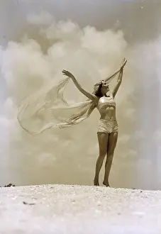 Woman in Swimsuit with Arms Outstretched