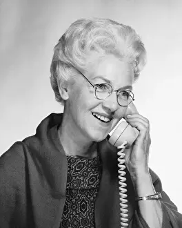 70 79 Years Prints: Woman talking on phone