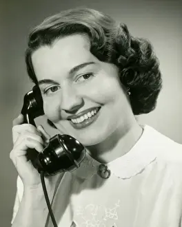 On The Phone Prints: Woman talking on phone, close-up, studio shot