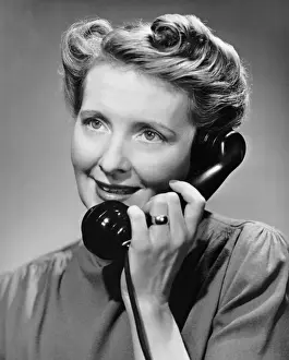 Woman talking on telephone