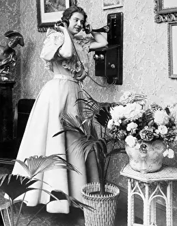 Woman Talking On The Telephone Early