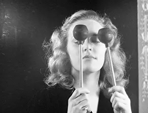 Eyesight Prints: Woman Tapping Eyes with Drumsticks