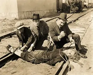 Teenage Boy Prints: Woman Being Tied to Railroad Tracks