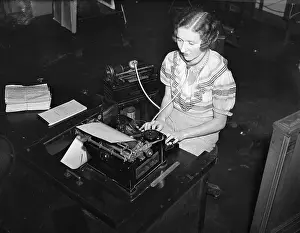 Typewriter Prints: Woman Transcribing From a Dictaphone