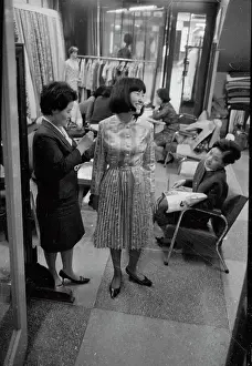 Trying On Prints: Woman Trying on Dress