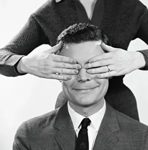 Girlfriend Prints: Woman using hands to cover eyes of smiling man