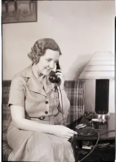 Woman Using Telephone