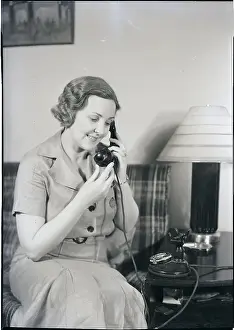 Woman Using Telephone