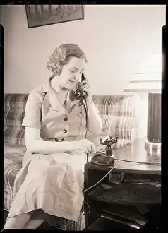 Woman Using Telephone